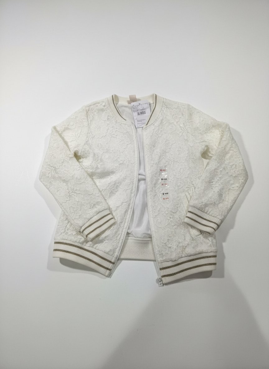 Gilet neuf en dentelle avec bordure en doré