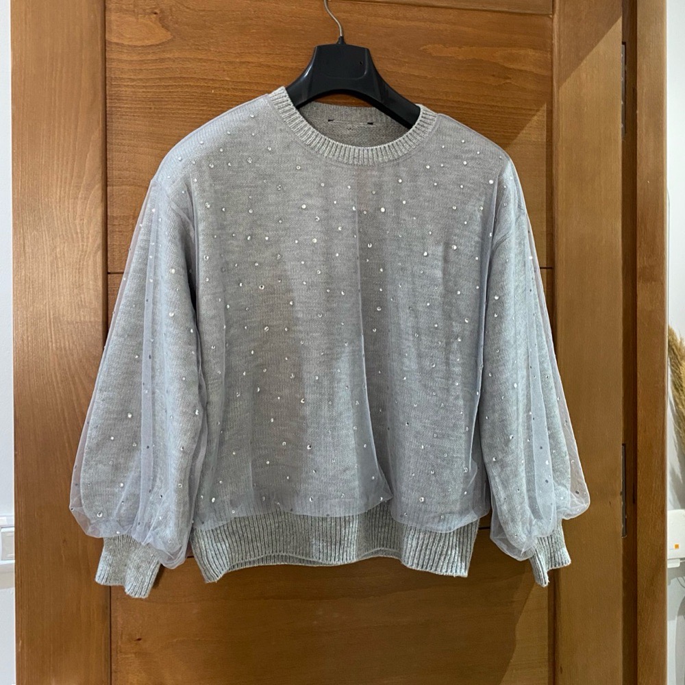 Pulls manches bouffantes avec des strass