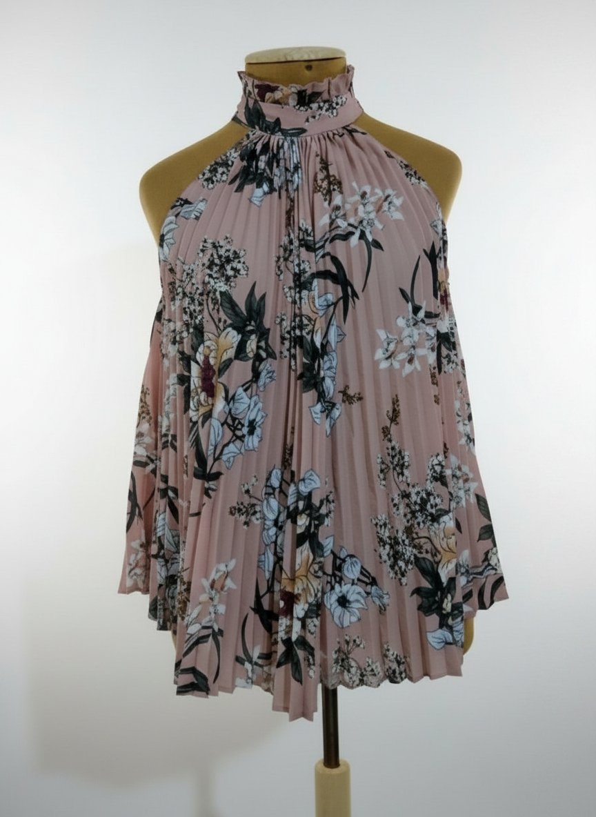 Un joli chemisier plissé état neuf la taille S/M/L 