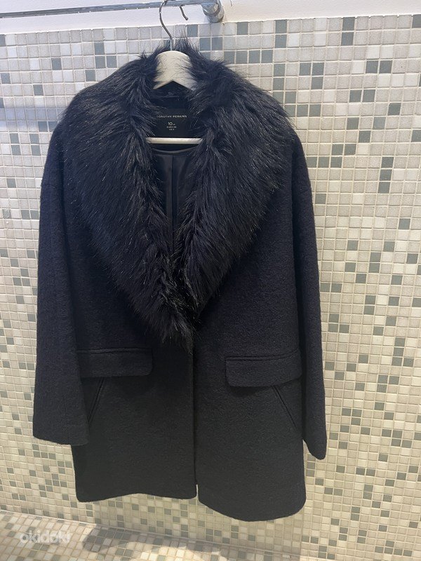 Très joli manteau bleu marine porté une seule fois la taille 44