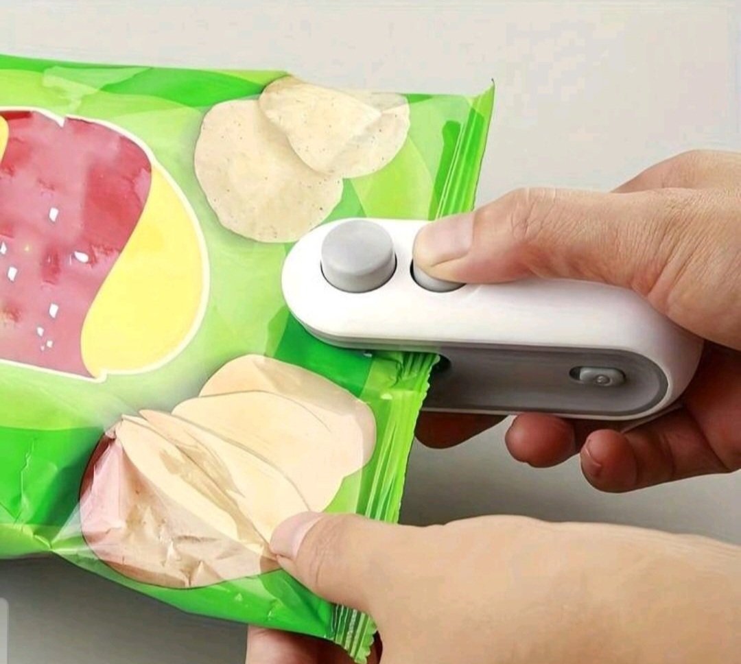 TRÈS EFFICACE ET UTILE subliiiiime ❤️❤️❤️mini machine de scellage de sac de collation magnétique rechargeable par le cable USB receller les paquets de chips et les biscuits.....neuf