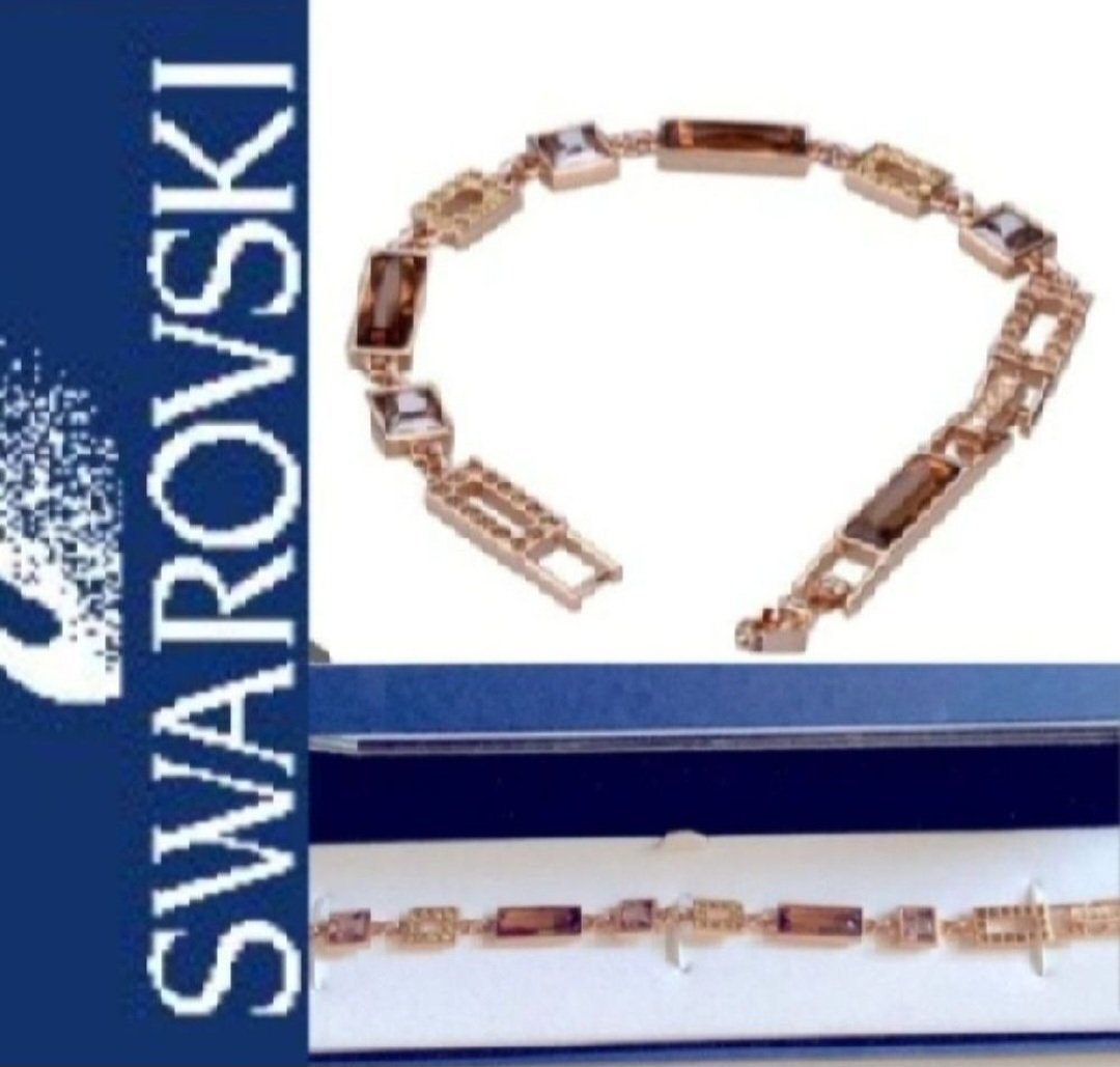 Subliiiiime❤️❤️❤️❤️ bracelet luxe swarovski authentique avec numéro de série très élégant et attrayant en or SWAROVSKI avec des cristaux rectangulairesde swarovski liés les uns aux autres avec un rajout supplémentaire pour la longueur très classe neuuuf 