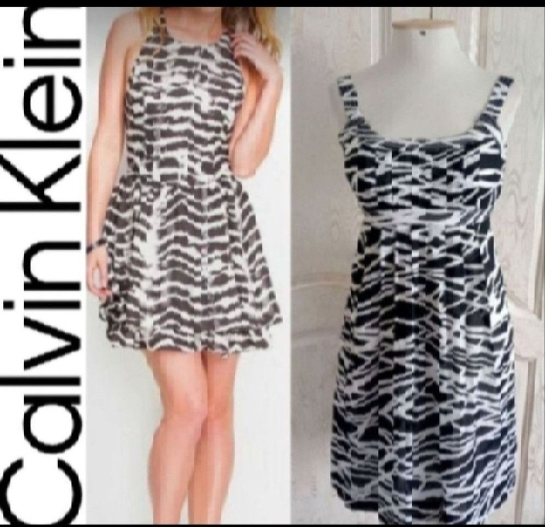Subliiiiime ❤️❤️❤️❤️robe 100% cotton tissu extraordinaire de CALVIN KLEIN taille 36