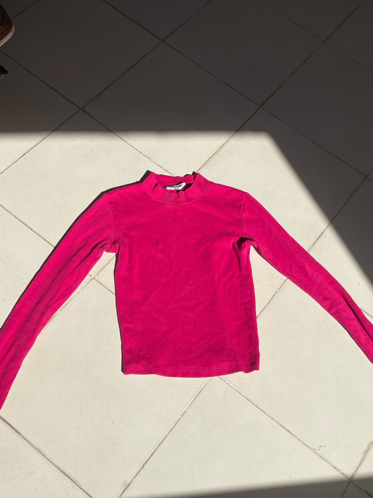 Pull rose col montant