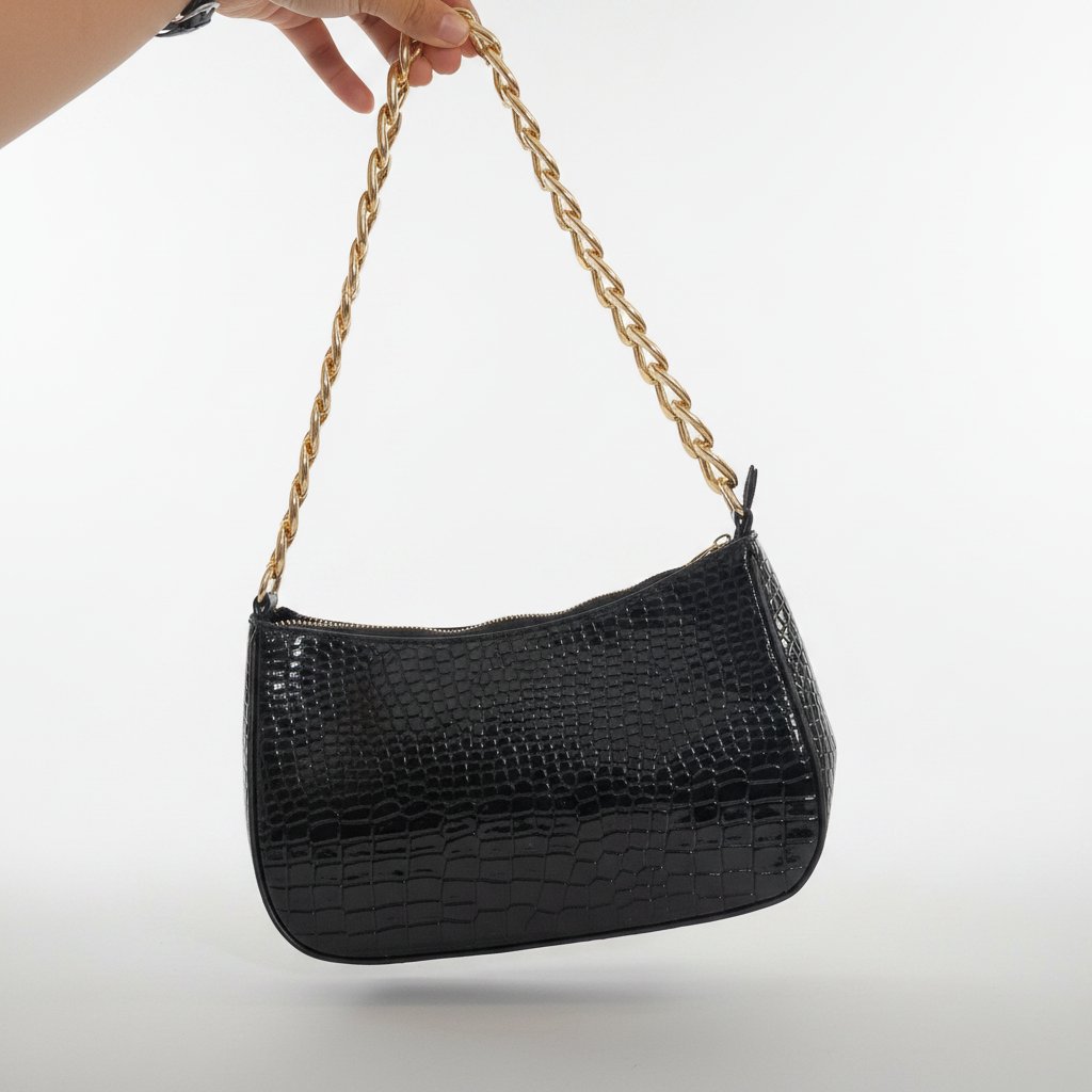 Black shoulder bag with gold chain