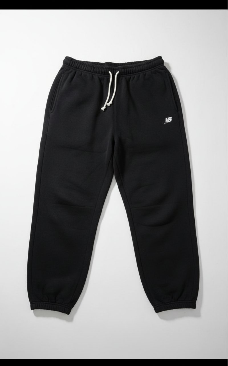 Pantalon NEW BALANCE noir taille L état 10/10.petit defaut 