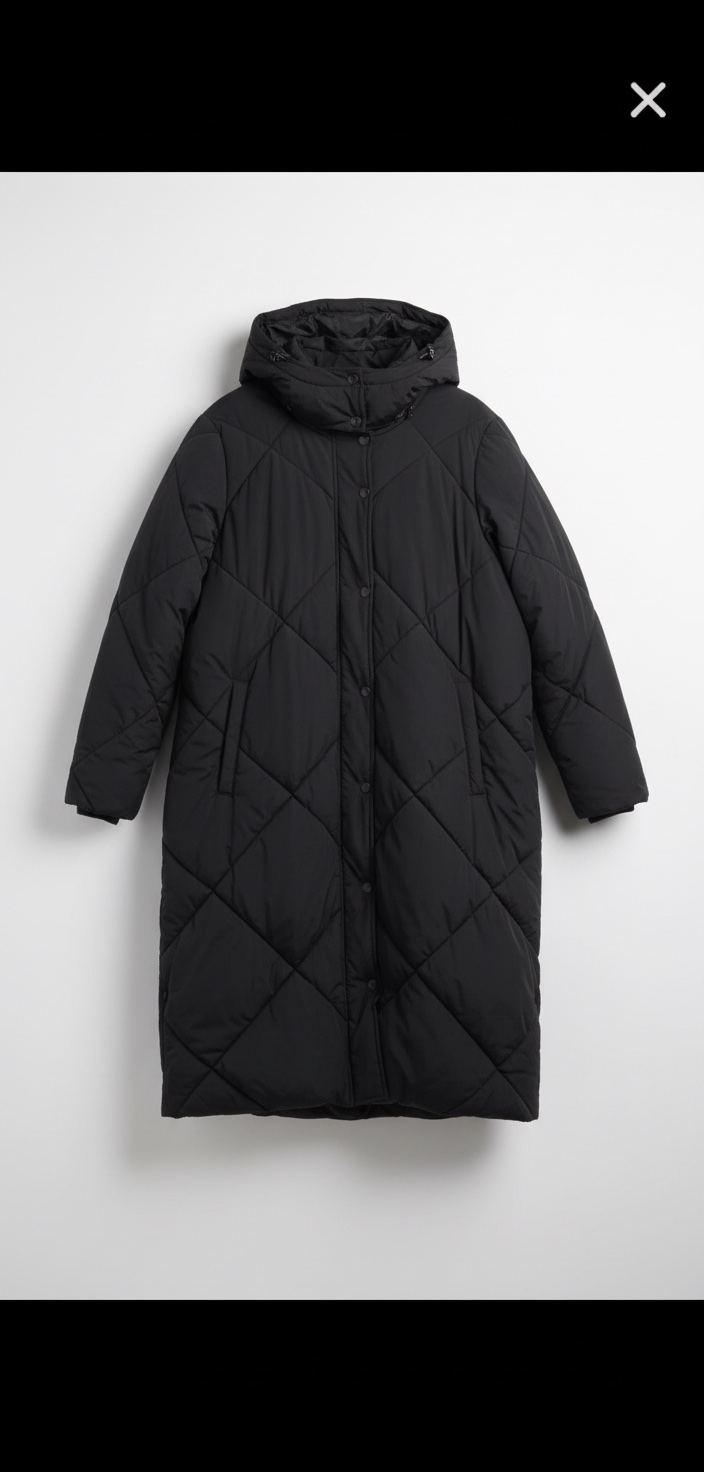 Manteau noir d'hiver long matelassé à capuche avec fente latérale pour femme| Reitmans