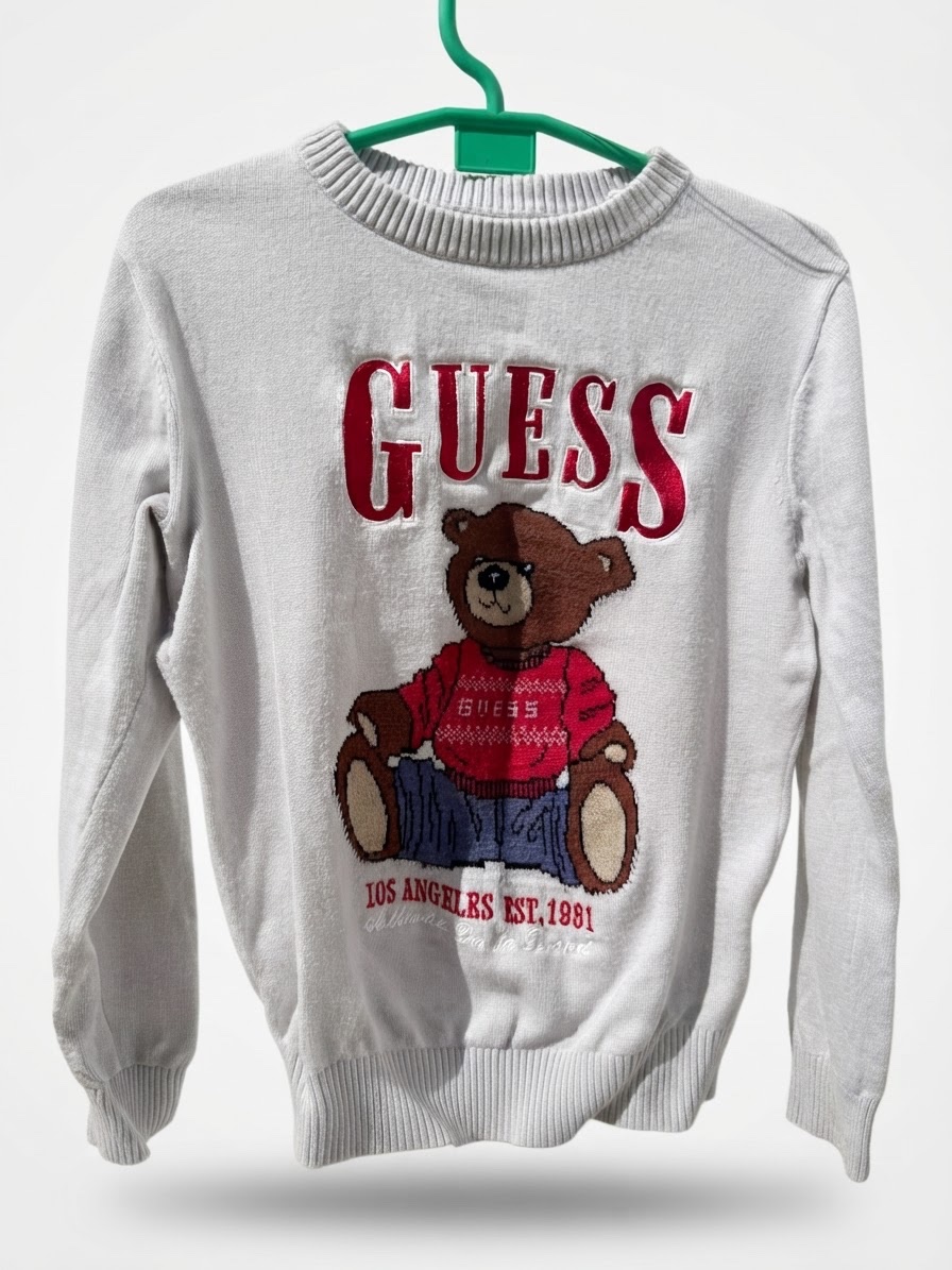 Pull de la marque GUESS pour garcon age 6/7 ans 