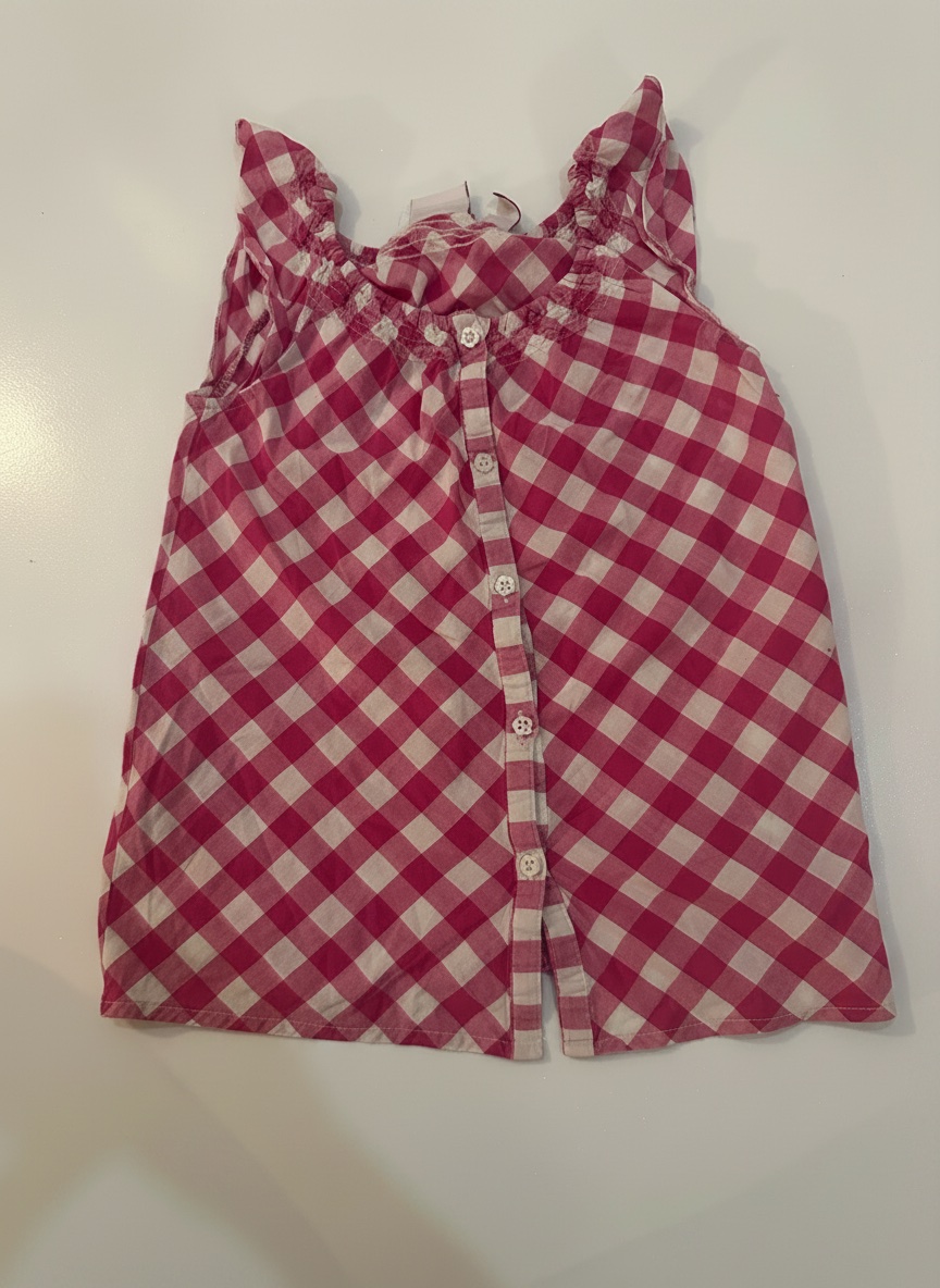 Cette robe sans manches pour bébé fille Sergent Major présente un motif vichy rose et blanc