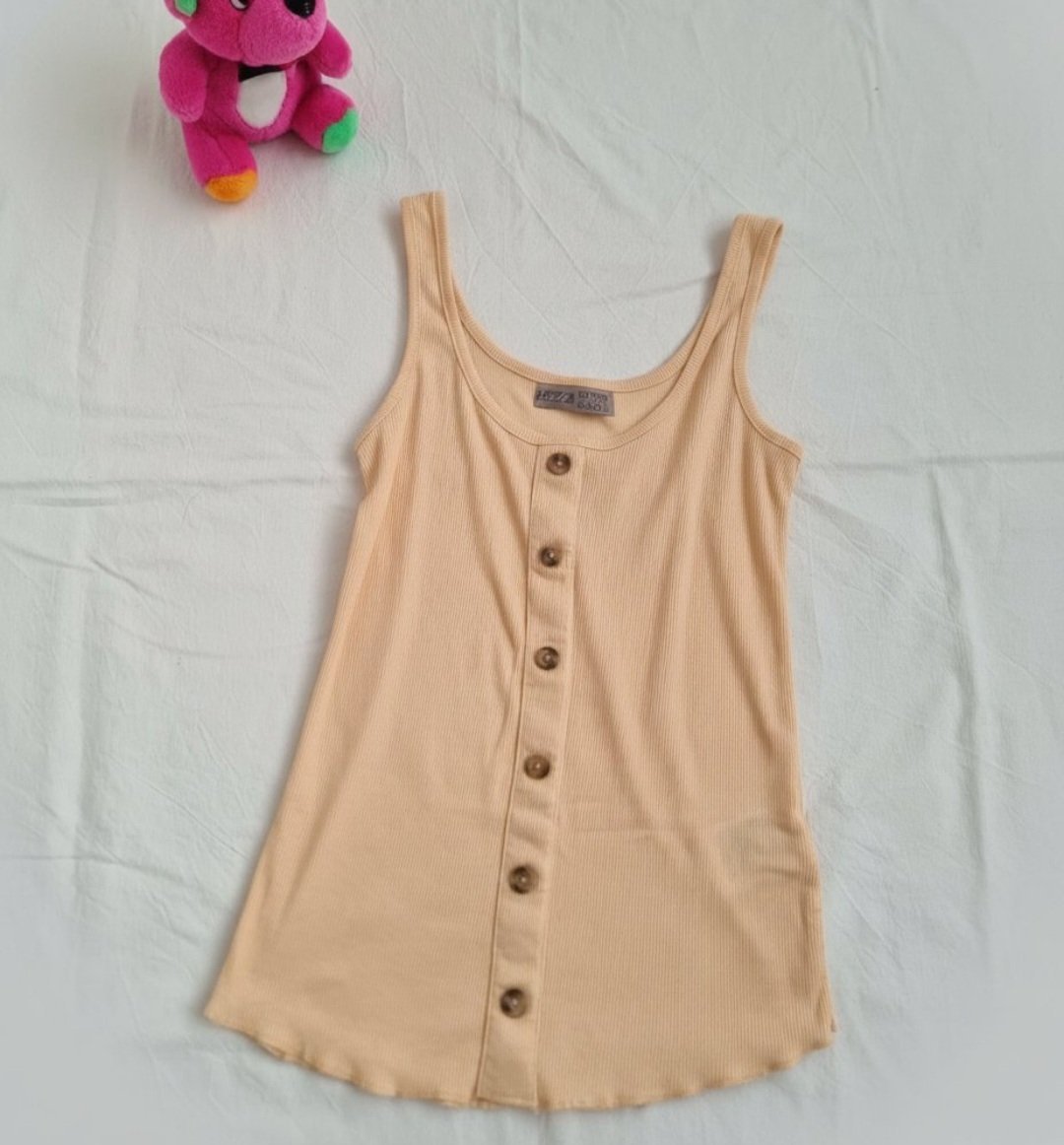 T_shirt sans manche 🌼🌼en trés bon état