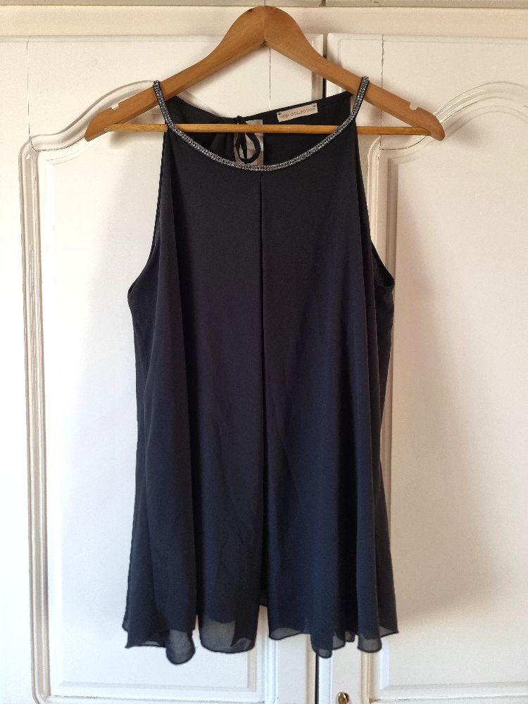 Chemise noir 🎀🎀 de la marque Nouvelle collection 🎀🎀 en trés bon état