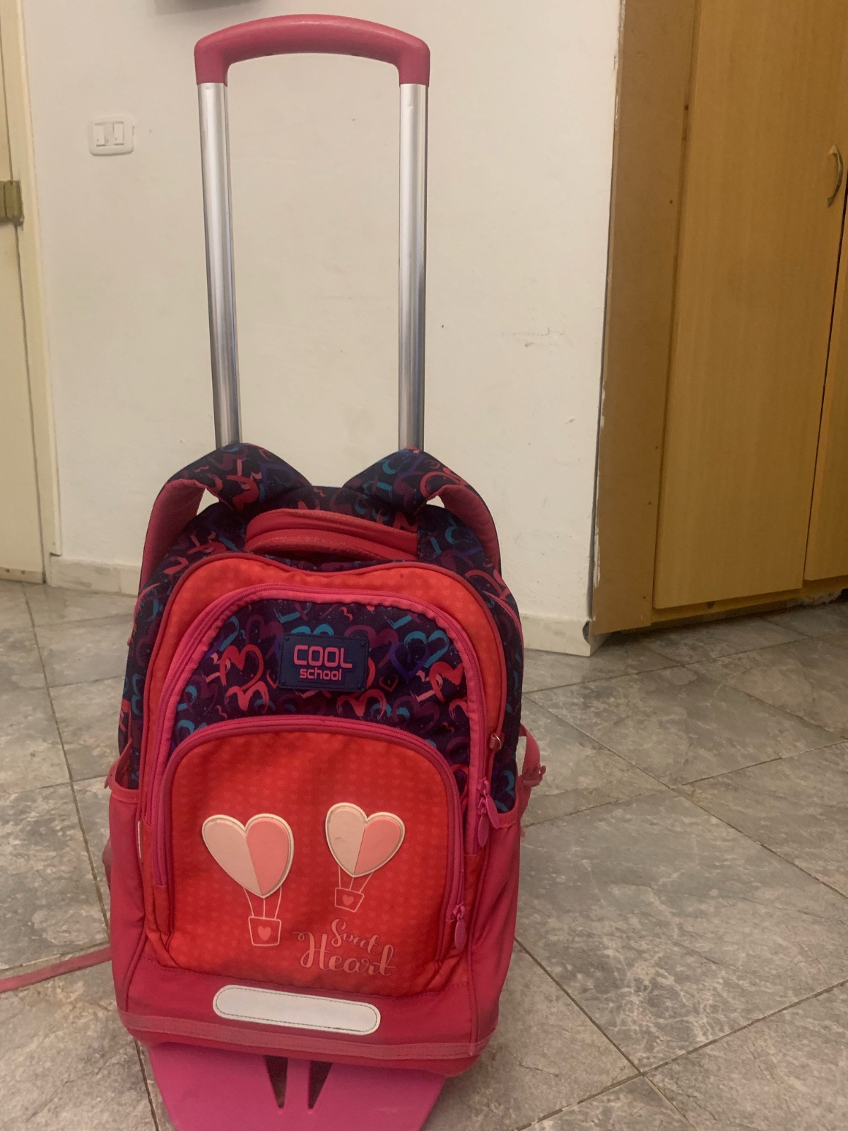 Cartable rose avec le chariot rose