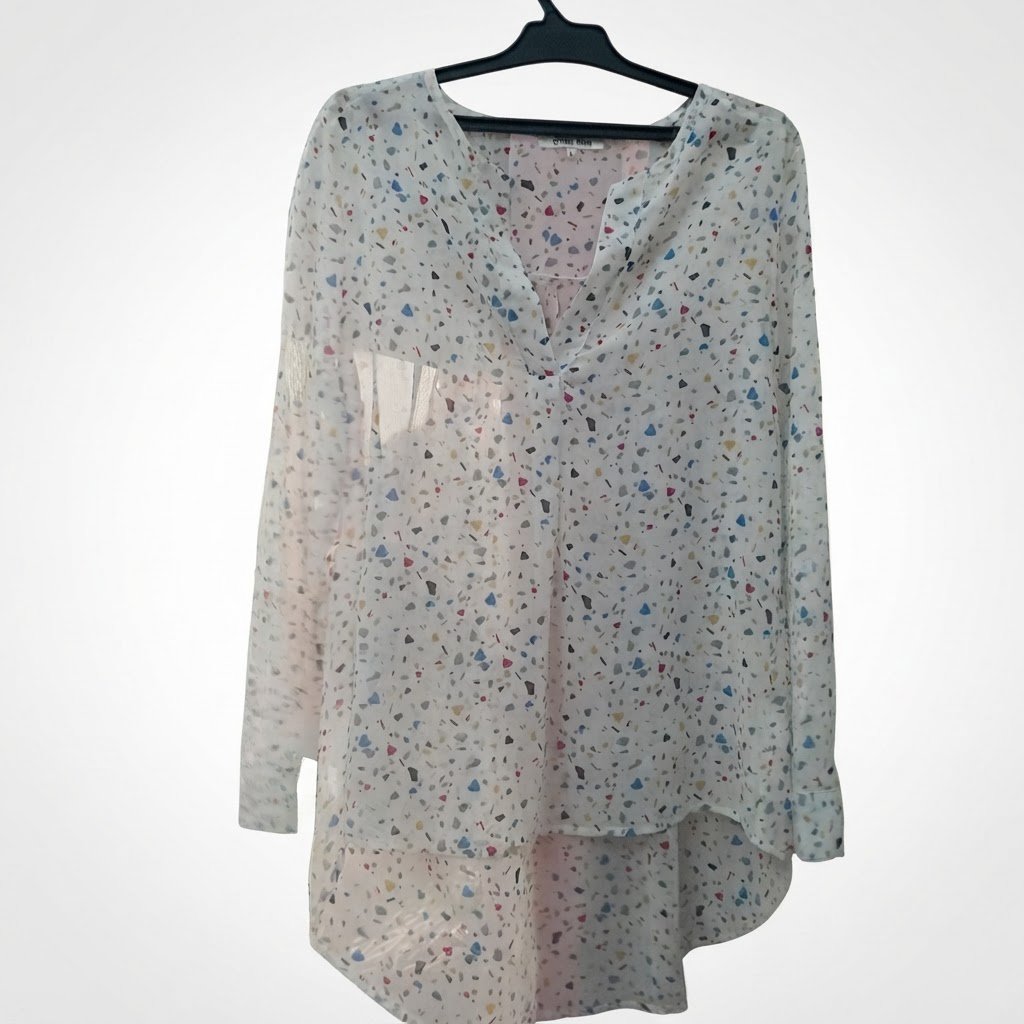 Chemise transparente mousseline coute devant et longue par derriere
