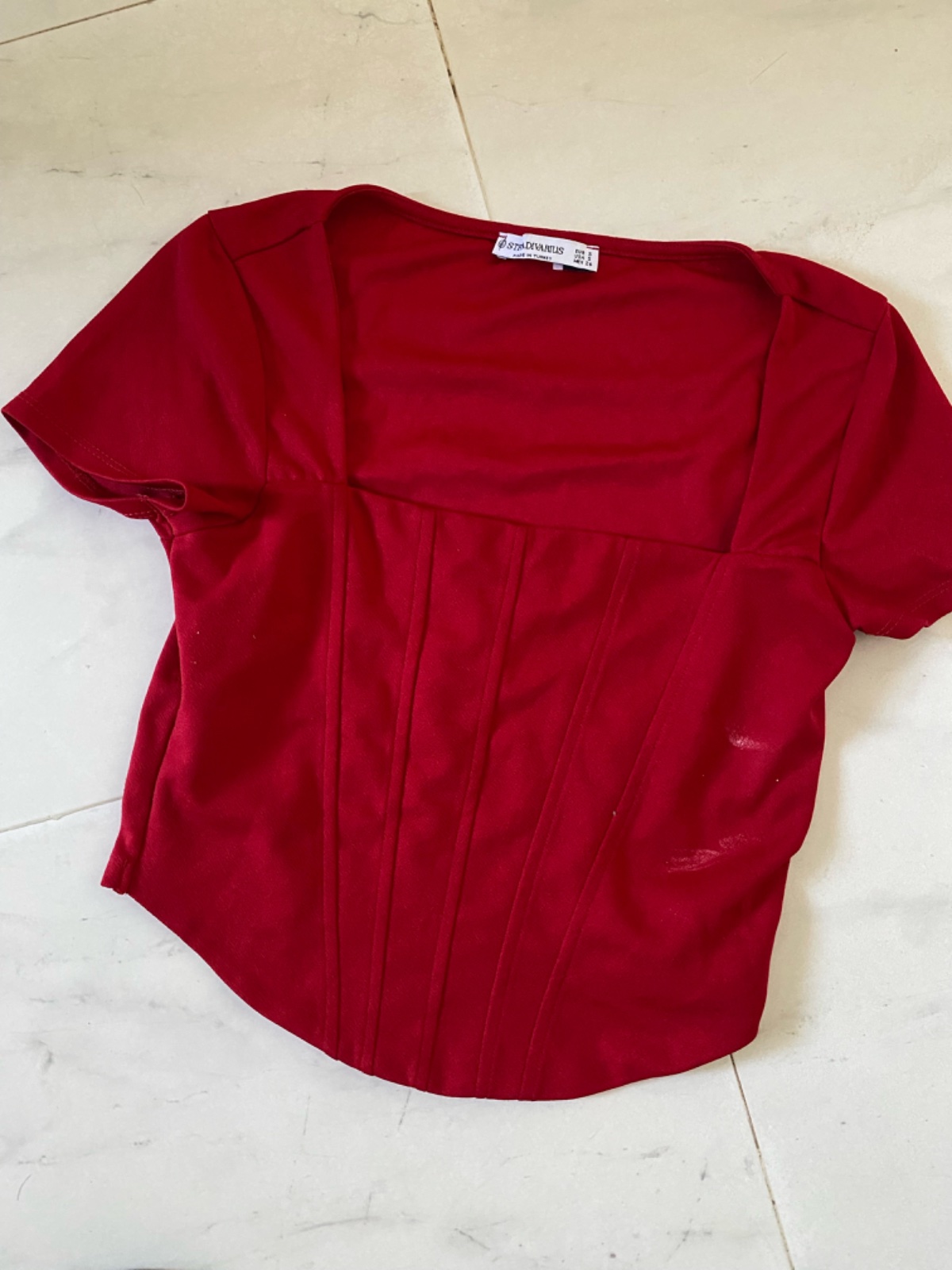 Top rouge stradi