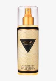 🔥🔥brume pour le corps Guess Seductive🔥 de la marque Guess (contenance de 250 ml), reconnaissable à son motif doré texturé et son triangle noir distinctif.