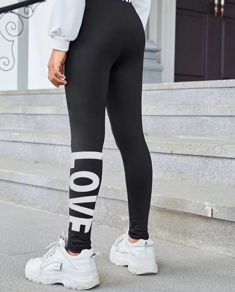 🔥Leggings noirs de la marque Ideology 🔥avec une inscription « LOVE » blanche et des rayures sur la jambe gauche. Taille 38 /40 / 42