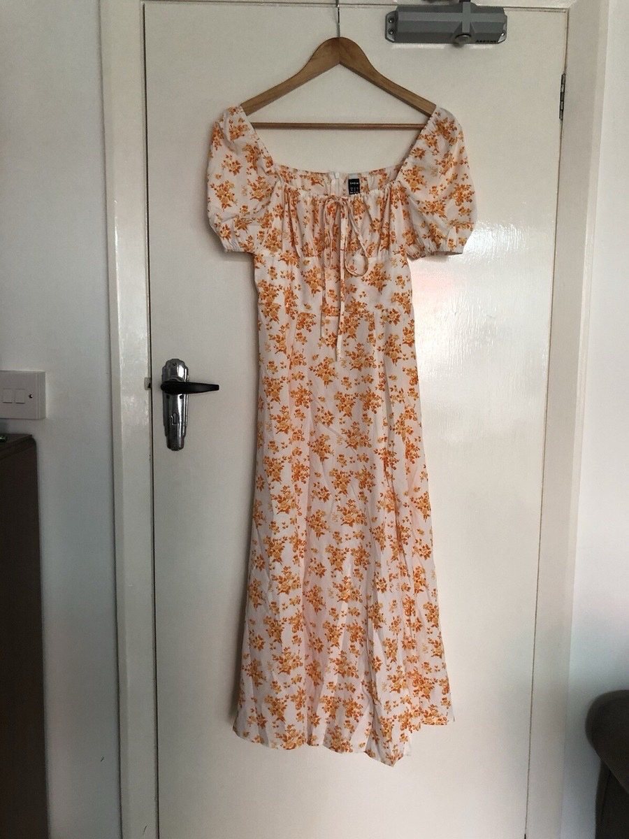 Robe blanche et orange à imprimé floral taille L
