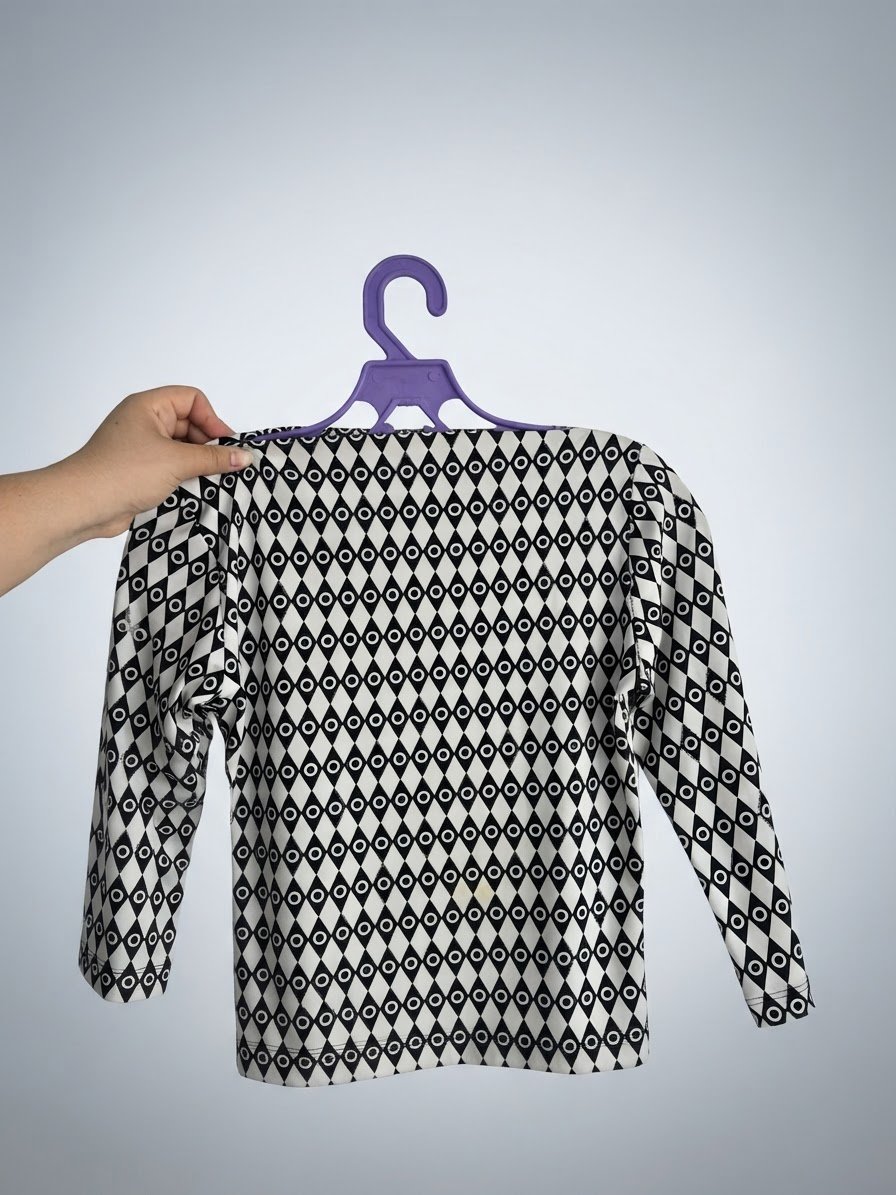 Pull de soirée noir et blanc à motifs géométriques