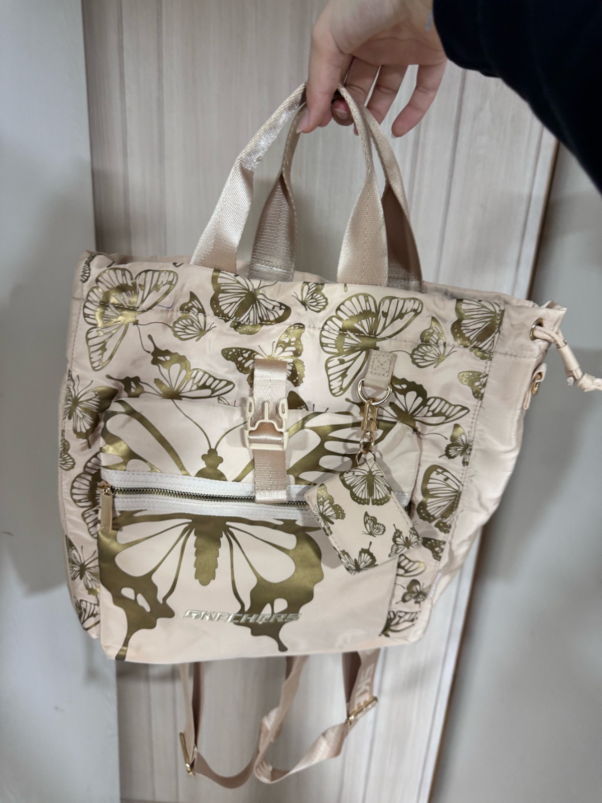 Sac à main multifonction beige imprimé papillons – style élégant et pratique