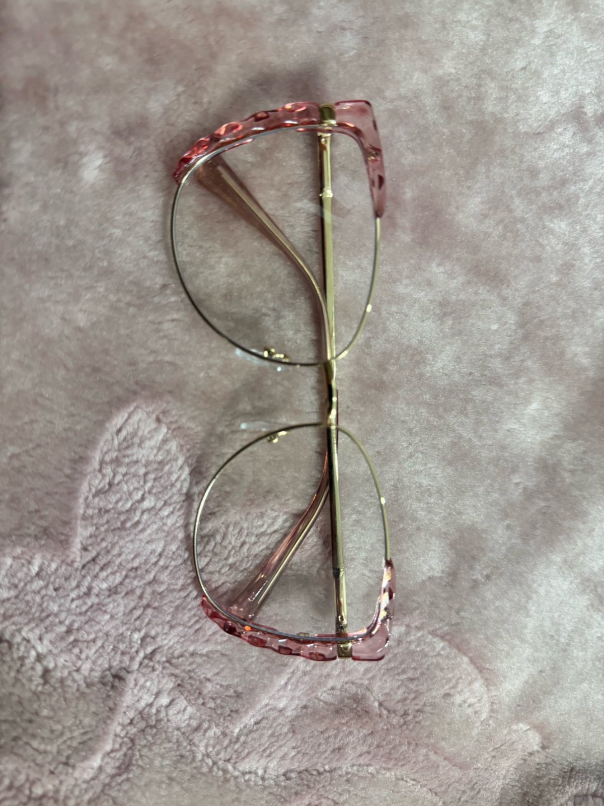 Lunettes oversize dorées avec monture rose transparente
