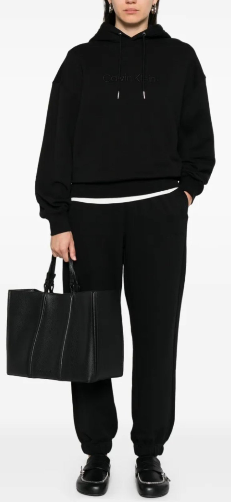 Pantalon marque COS. Doté d'une taille élastique 