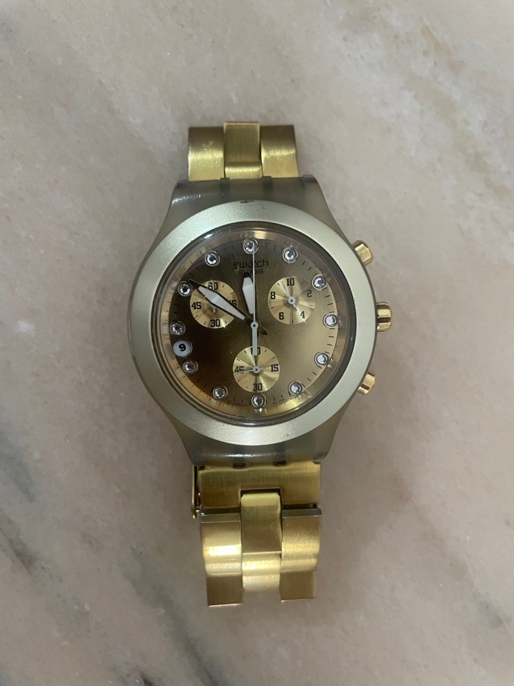 Montre swatch dorée femme 