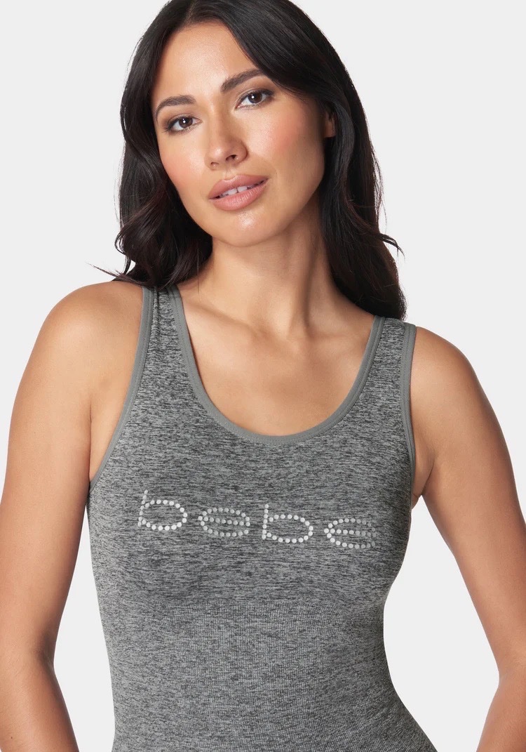 Un débardeur de sport gris de la marque Bebe Taille XL42/44
