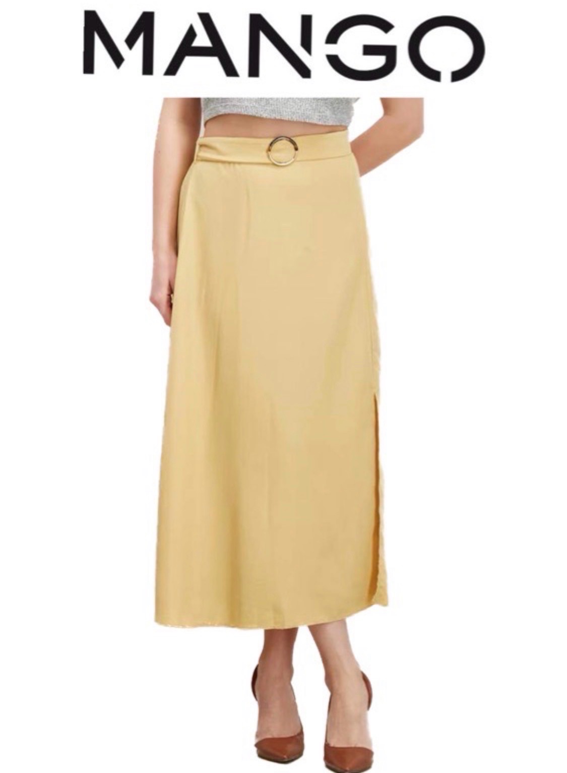 Jupe midi jaune pastel (ou vanille) de la marque Mango, caractérisée par sa ceinture assortie dotée d'une boucle ronde métallique et sa fente sur le devant taille XL 42