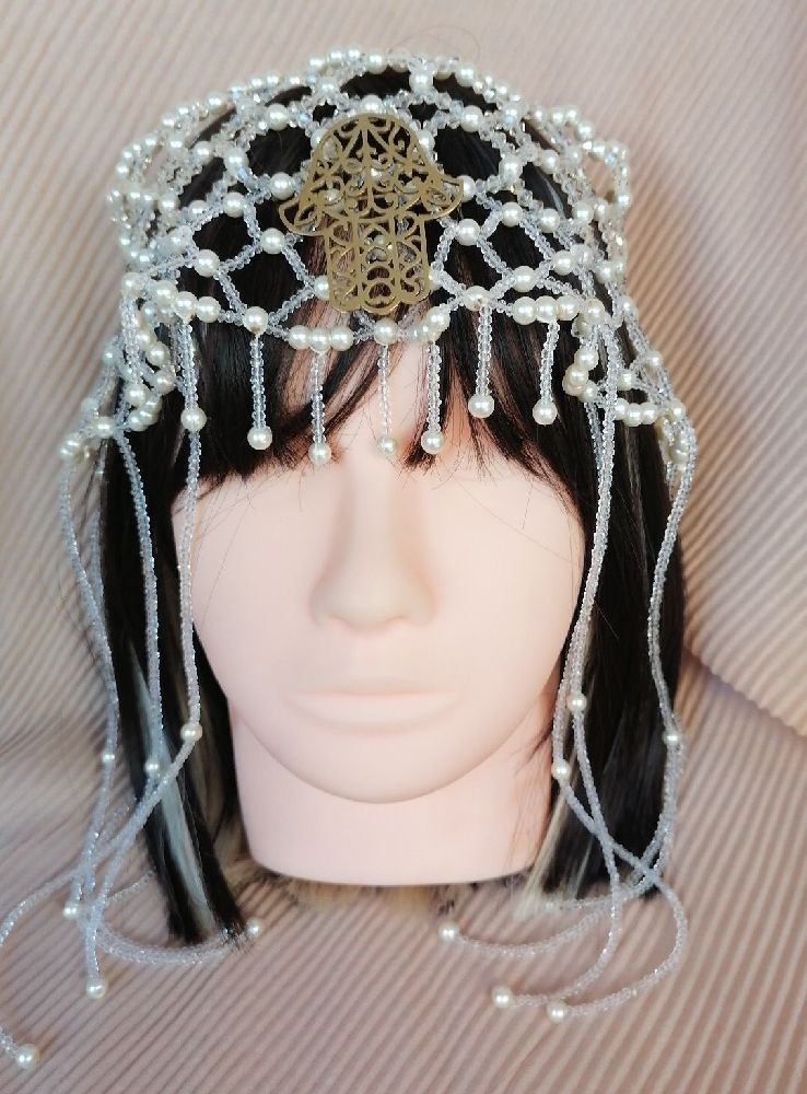 Chapeau de luxe avec pompon en perles 