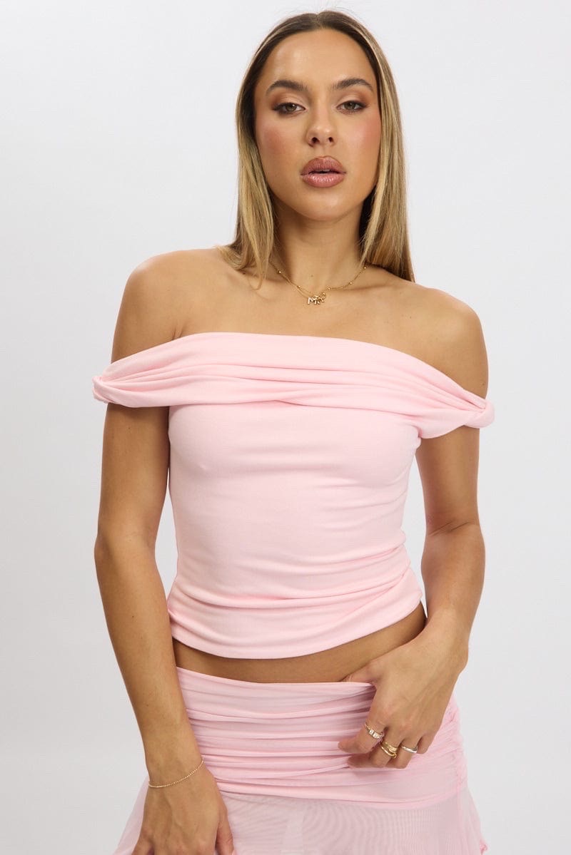 Off-the-shoulder ruched top in a light pink shade
