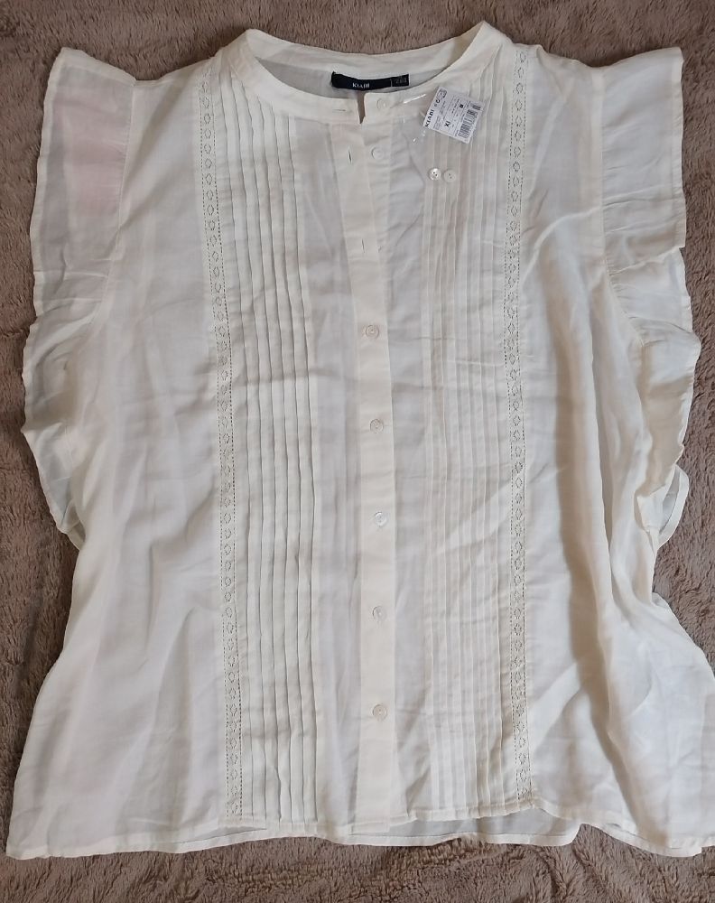 chemise sans manches à volants